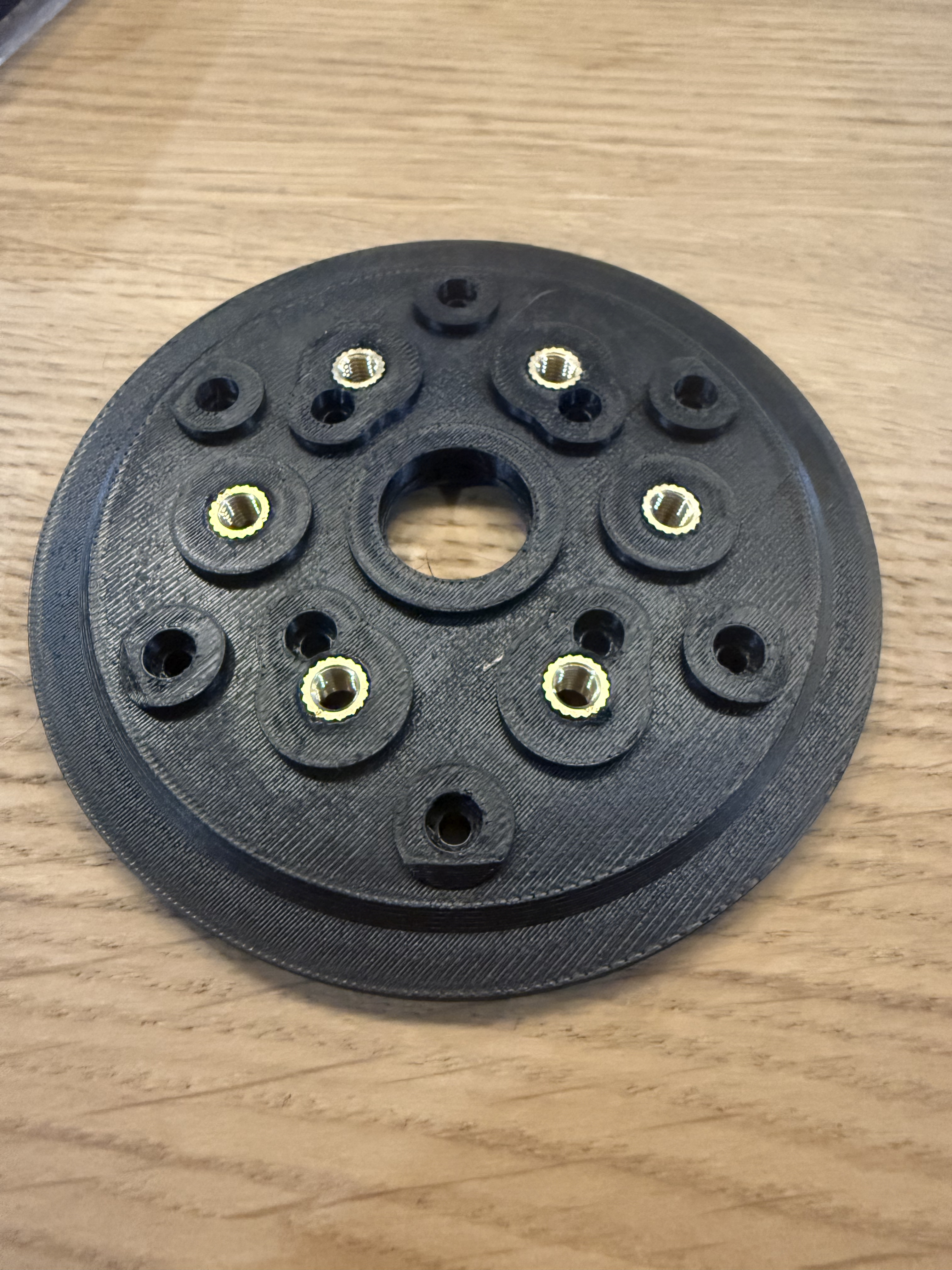Cycloidal disc with heat-set inserts