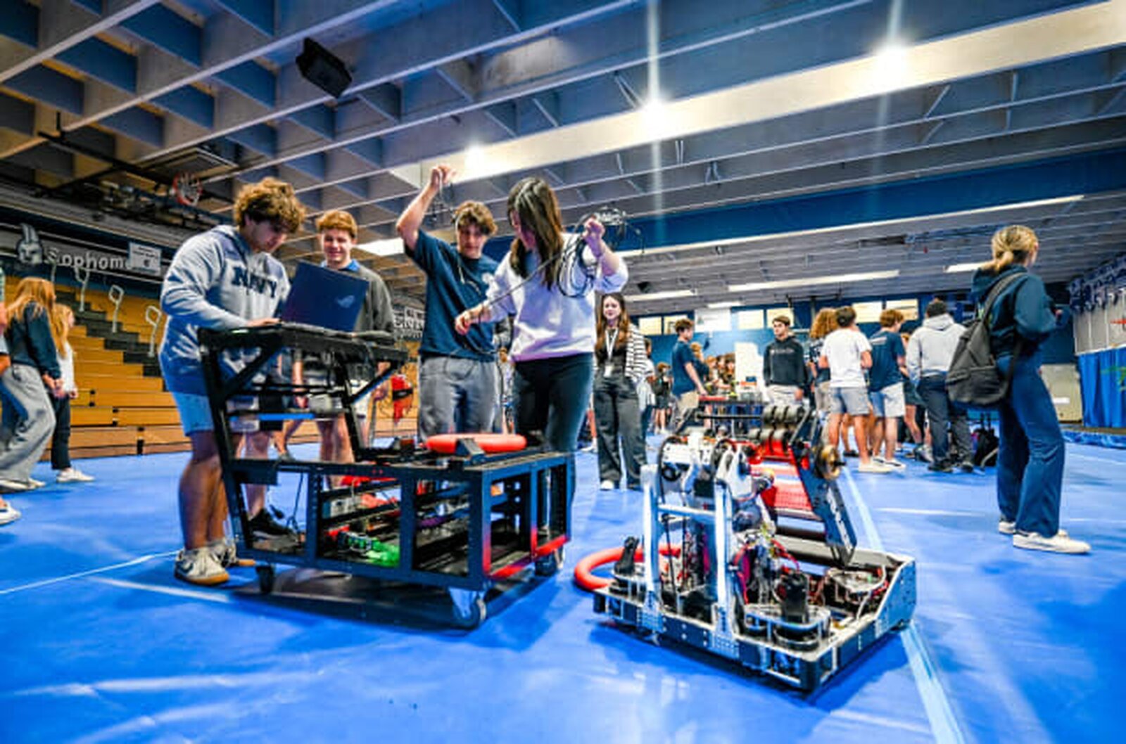 The team at competition with both robots